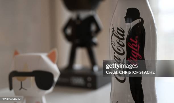 The outline representing late German fashion designer, designer, photographer and costume designer Karl Lagerfeld is seen on a Coca Cola light bottle...