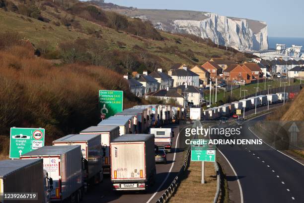 Queues of lorries snake their way into the town of Dover on the south-east coast of England, on March 17, 2022. - Dubai-owned P&O Ferries on Thursday...