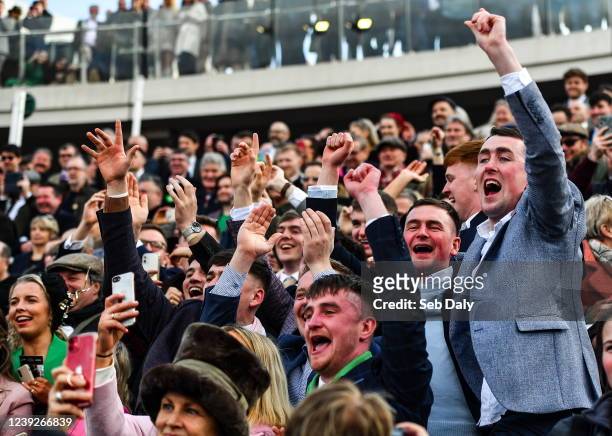 Gloucestershire , United Kingdom - 17 March 2022; Racegoers celebrate after Flooring Porter, with Danny Mullins up, won the Paddy Power Stayers'...