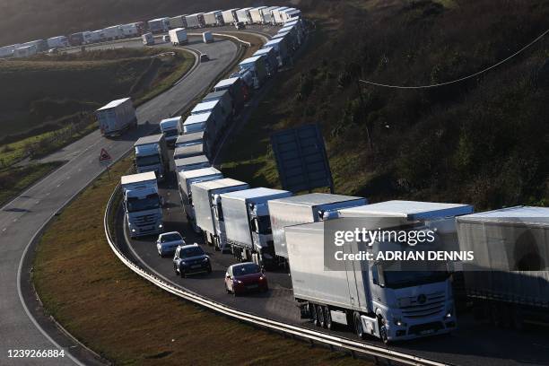 Queue of lorries snakes it's way into the town of Dover on the south-east coast of England, on March 17, 2022. - Dubai-owned P&O Ferries on Thursday...