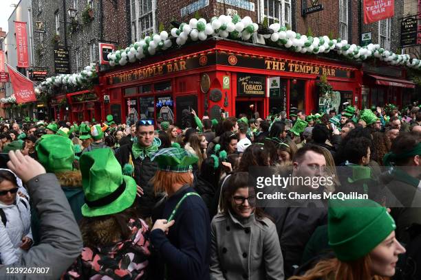 Thousands of revellers pack the Templebar disctrict following the Saint Patricks day parade on March 17, 2022 in Dublin, Ireland. The annual Saint...