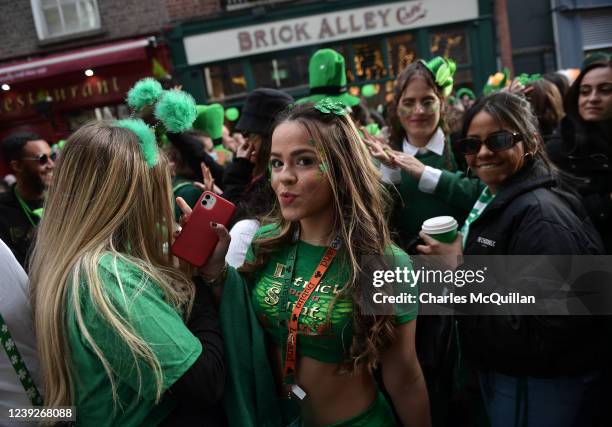 Thousands of revellers pack the Templebar disctrict following the Saint Patricks day parade on March 17, 2022 in Dublin, Ireland. The annual Saint...