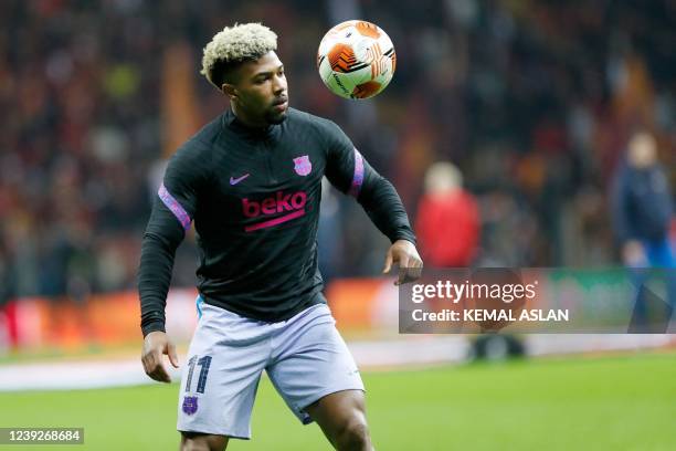 Barcelona's Spanish forward Adama Traore warms up prior to the UEFA Europa League round of 16 secong leg football match between Galatasaray and...