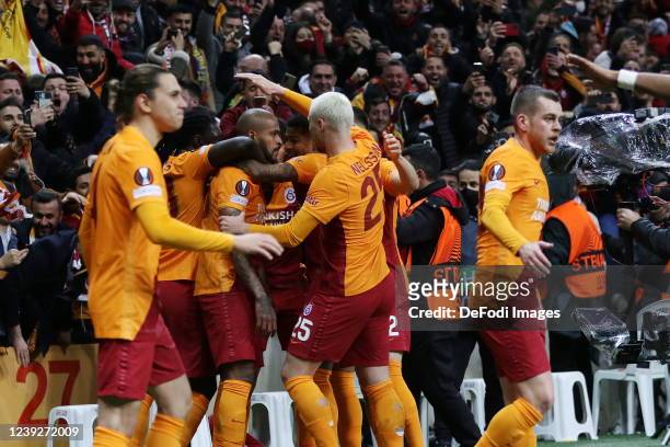 Marcao of Galatasaray celebrates after scoring his team's first goal with teammates during the UEFA Europa League Round of 16 Leg Two match between...
