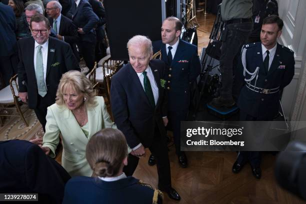 President Joe Biden and U.S. First Lady Jill Biden depart during a St. Patrick's Day event in the East Room of the White House in Washington, D.C.,...