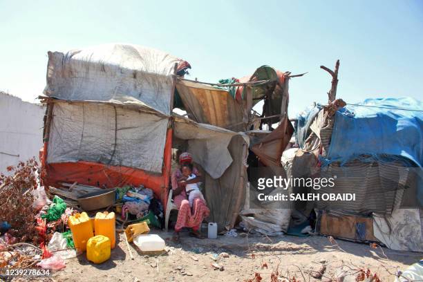 Ethiopian refugees are pictured at a camp for migrants of African origin in the Khor Maksar district of Yemen's second city of Aden on March 3, 2022.