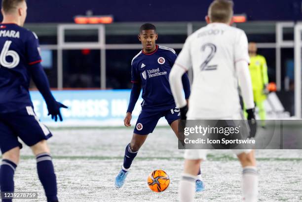 New England Revolution midfielder Lucas Maciel Felix looks to pass to New England Revolution midfielder Tommy McNamara during a match between the New...