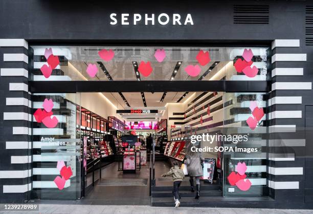 Shoppers are seen at the French multinational personal care and beauty retail brand Sephora store in Spain.