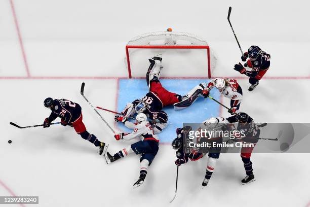 Oliver Bjorkstrand of the Columbus Blue Jackets clears the puck in the second period during a game against the Washington Capitals at Nationwide...