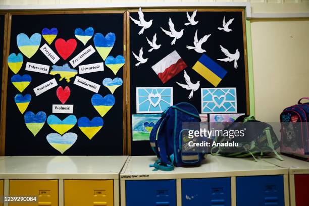 Decorations about Ukraine are seen on a board at a primary school where children fleeing from Ukraine due Russian attacks attend classes together...