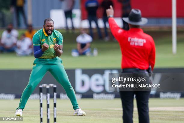 South Africa's Andile Phehlukwayo celebrates the dismissal of Bangladesh's Tamim Iqbal during the first one-day international cricket match between...