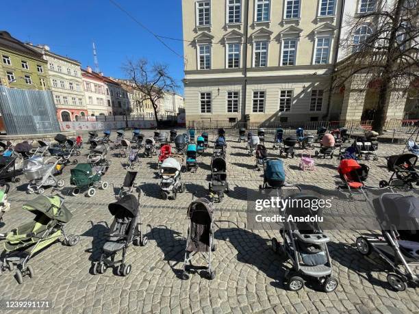 Children, who were declared dead in the attacks launched by Russia on February 24, are commemorated with empty baby carriages left in the town square...