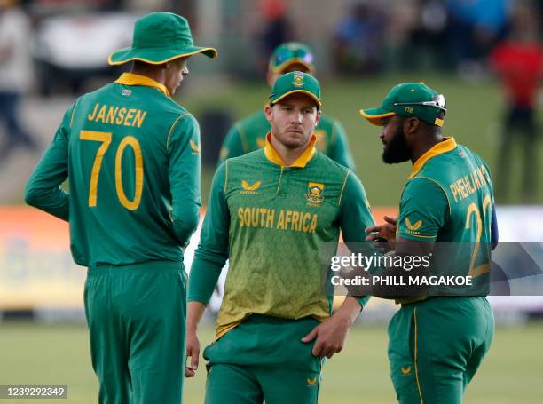 South Africa's Marco Jansen, David Miller, and Andile Phehlukwayo talk during a break during the first one-day international cricket match between...