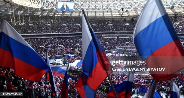 Russian President Vladimir Putin attends a concert marking the eighth anniversary of Russia's annexation of Crimea at the Luzhniki stadium in Moscow...