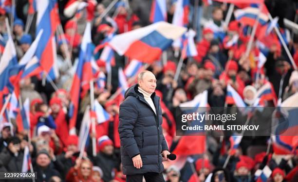 Russian President Vladimir Putin attends a concert marking the eighth anniversary of Russia's annexation of Crimea at the Luzhniki stadium in Moscow...