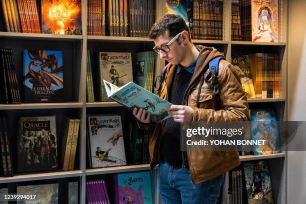 Visitor looks at Delcourt comics book at Le Monde des Bulles section during the 49th Angouleme International Comics Festival , in Angouleme, western...