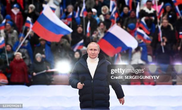 Russian President Vladimir Putin attends a concert marking the eighth anniversary of Russia's annexation of Crimea at the Luzhniki stadium in Moscow...