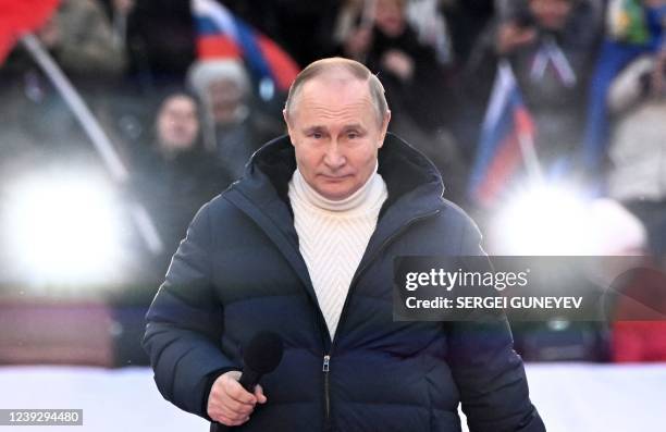 Russian President Vladimir Putin attends a concert marking the eighth anniversary of Russia's annexation of Crimea at the Luzhniki stadium in Moscow...