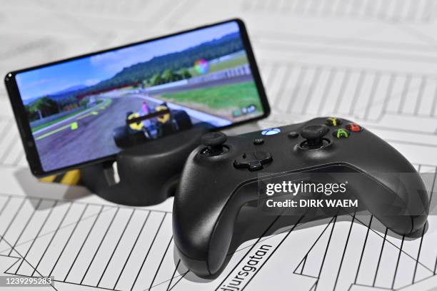 Illustration picture shows a Microsoft Xbox controller with a 5G phone during a visit to Ericsson company in Kista, Stockholm during a visit to...