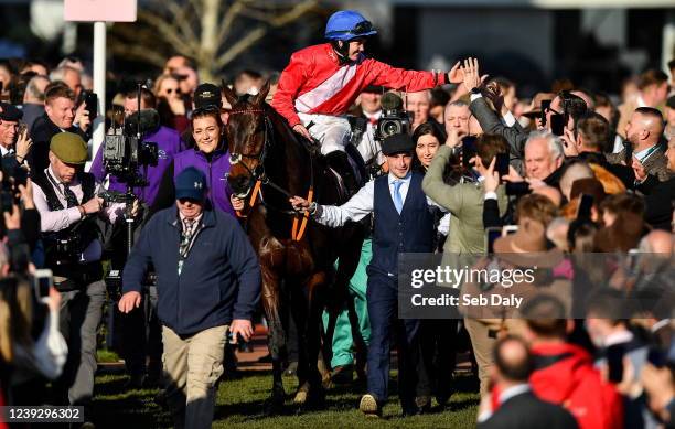 Gloucestershire , United Kingdom - 18 March 2022; Rachael Blackmore celebrates aboard A Plus Tard as they are led into the parade ring by groom John...