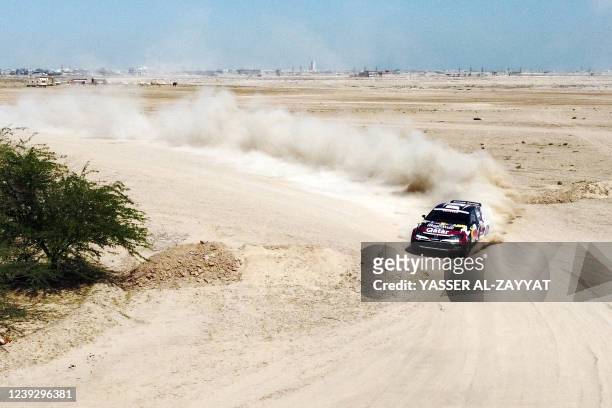 Nasser al-Attiyah of Qatar and his co-driver Matthieu Baumel of France compete in their Volkswagen Polo GIT during the Kuwait International Rally...