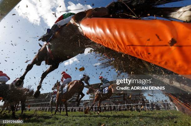 Call Me Lyreeen ridden by jockey Rob James , Top Bandit ridden by jockey Davy Russell and Cormier ridden by jockey Sean Quintan compete in the Coutny...