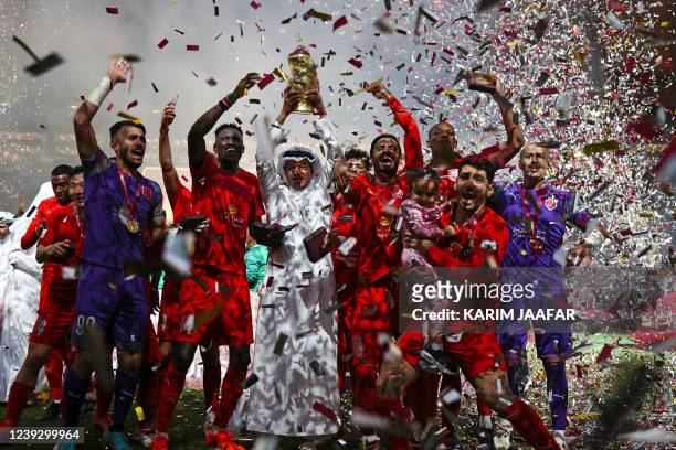 Duhail's players celebrate with the trophy after winning the Qatar Amir Cup Final between Al-Duhail and Al-Gharafa at the Khalifa International...