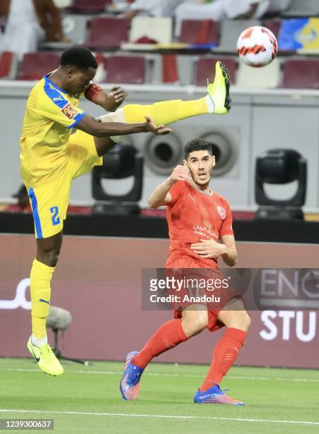 Karim Boudiaf of Al Duhail in action against Saeed Alhaj Essa of Al-Gharafa during the Qatar Amir Cup Final between Al-Duhail and Al-Gharafa at the...