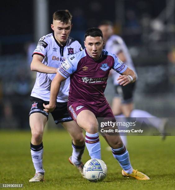 Louth , Ireland - 18 March 2022; Chris Lyons of Drogheda United in action against Lewis Macari of Dundalk during the SSE Airtricity League Premier...