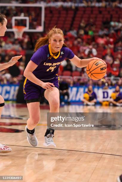 Albany guard Grace Heeps drives to the basket during the first round of the NCAA Women's National Championship Tournament college basketball game...