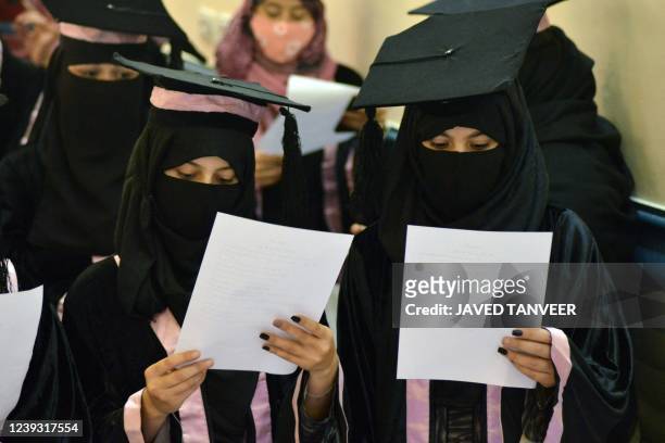 Students from the faculties of Political Science and Medicine attend their graduation ceremony at the Malalai University in Kandahar on March 19,...