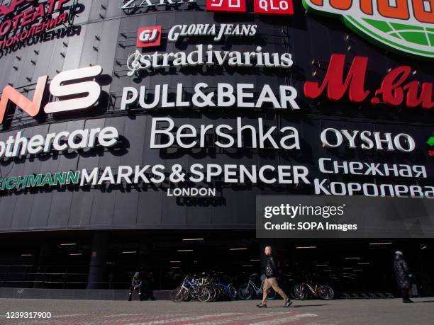 Brand names such as Marks & Spencer, Bershka, Zara, Oysho, Stradivarius, Pull&Bear, Gloria Jeans are displayed on the faÃ§ade of Salarievo, a large...