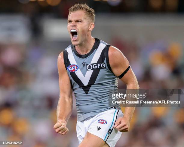 Dan Houston of the Power celebrates a goal during the 2022 AFL Round 01 match between the Brisbane Lions and the Port Adelaide Power at The Gabba on...