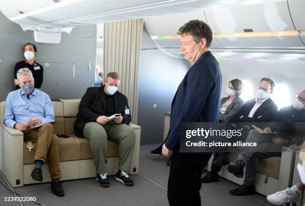 March 2022, Qatar, Doha: Robert Habeck , Federal Minister for Economic Affairs and Climate Protection, talks to fellow journalists during a...