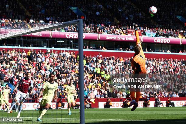 Arsenal's German goalkeeper Bernd Leno punches the ball during the English Premier League football match between Aston Villa and Arsenal at Villa...
