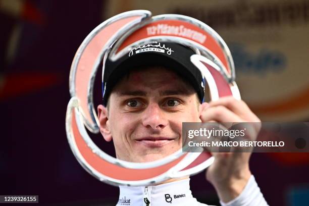 Team Bahrain's Matej Mohoric of Slovenia celebrates on the podium after winning the 113th Milan-San Remo one-day classic cycling race, on March 19,...