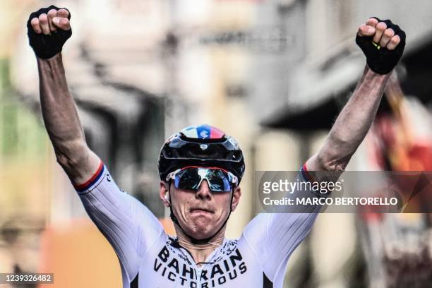 Team Bahrain's Matej Mohoric of Slovenia celebrates as he crosses the finish line to win the 113th Milan-San Remo one-day classic cycling race, on...