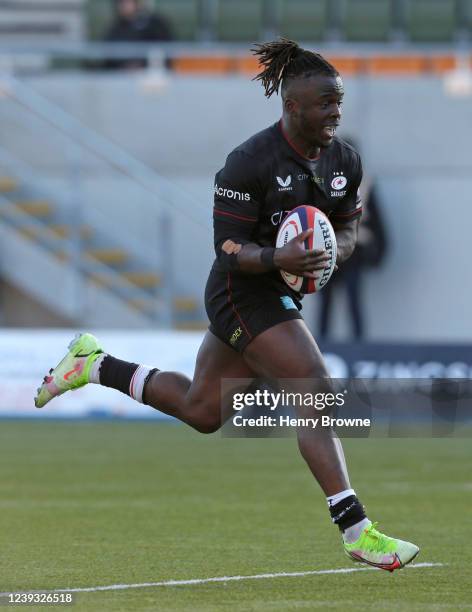 Rotimi Segun of Saracens runs in to score a try during the Premiership Rugby Cup match between Saracens and Northampton Saints at StoneX Stadium on...