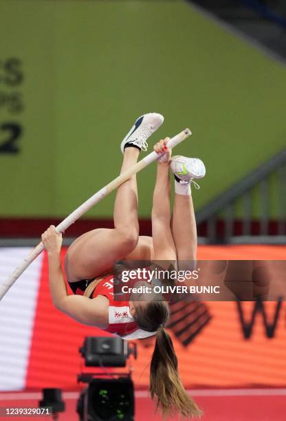 Switzerland's Angelica Moser competes in the women's pole vault final during The World Athletics Indoor Championships 2022 at the Stark Arena, in...