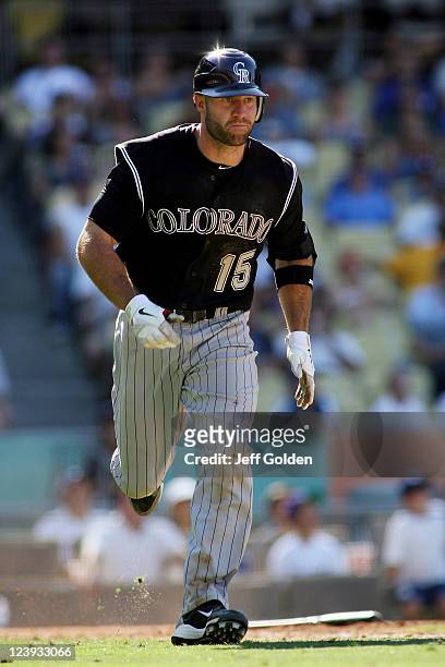 Kevin Kouzmanoff of the Colorado Rockies runs to first base as he pops out to second base against the Los Angeles Dodgers to end the seventh inning...