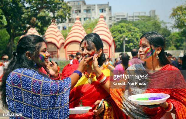 People spread abir celebrating Dol Purnima festival at Dhakeshwari national temple in Dhaka, Bangladesh, on 18 March 2022.