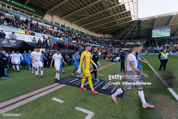 Matt Grimes of Swansea City leads his team mates out of the tunnel prior to the Sky Bet Championship match between Swansea City and Birmingham City...