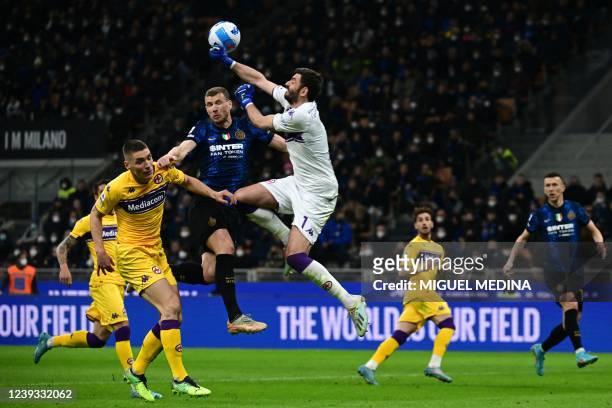 Fiorentina's Serbian defender Nikola Milenkovic, Inter Milan's Bosnian forward Edin Dzeko and Fiorentina's Italian goalkeeper Pietro Terracciano go...