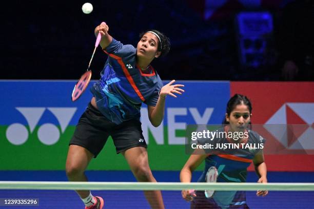 India's Treesa Jolly playing with India's Gayatri Gopichand Pullela returns to China's Zheng Yu and China's Zhang Shuxian during the women's doubles...