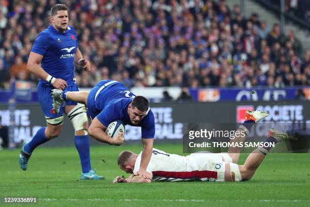 France's hooker Julien Marchand is tackled by England's flanker Sam Underhill during the Six Nations rugby union tournament match between France and...