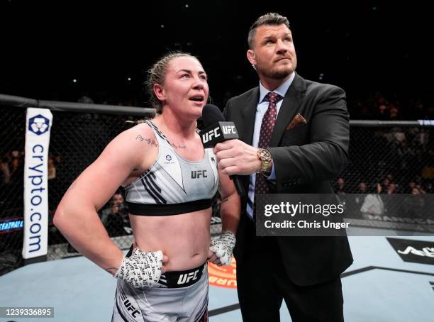 Molly McCann of England speaks with announcer Michael Bisping after knocking out Luana Carolina of Brazil in a womens flyweight fight during the UFC...