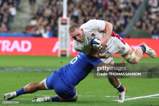 England's flanker Sam Underhill is tackled during the Six Nations rugby union tournament match between France and England at the Stade de France in...