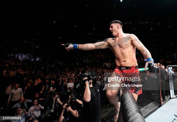 Tom Aspinall of England celebrates his submission victory over Alexander Volkov of Russia in a heavyweight fight during the UFC Fight Night event at...