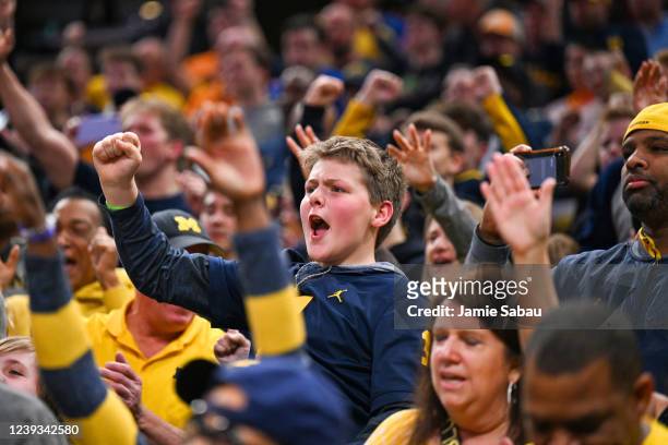 Young fan of the Michigan Wolverines cheers on during second half action against the Tennessee Volunteers in the second round of the 2022 NCAA Men's...