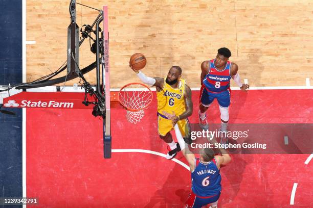 LeBron James of the Los Angeles Lakers shoots the ball during the game to pass Karl Malone on the NBAs all-time scoring list during the game against...